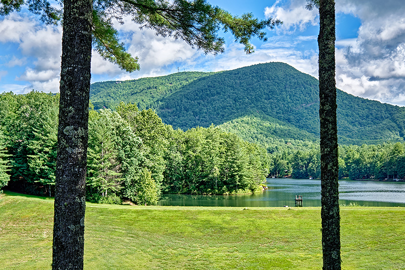 This is a picture of a table on a deck overlooking mountains in Sapphire Valley